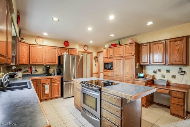 kitchen with sink, light tile patterned floors, a center island, and appliances with stainless steel finishes