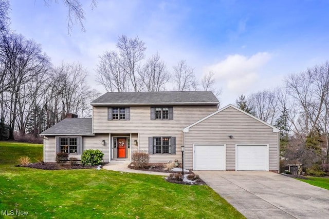 view of front facade featuring a garage and a front yard