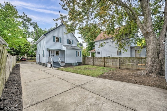 back of property with a yard and cooling unit