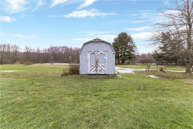 view of outbuilding with a lawn