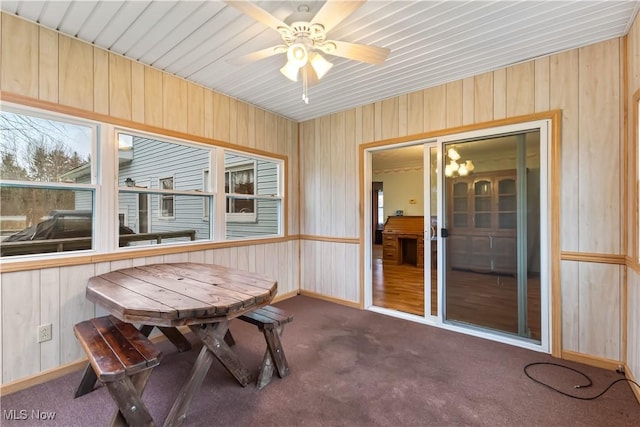 sunroom featuring ceiling fan