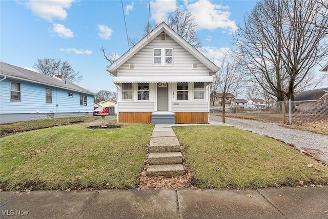 bungalow-style home featuring a front yard