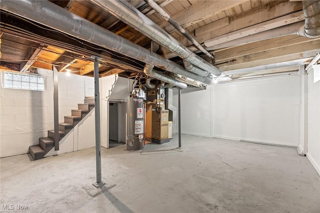 basement featuring heating unit and gas water heater