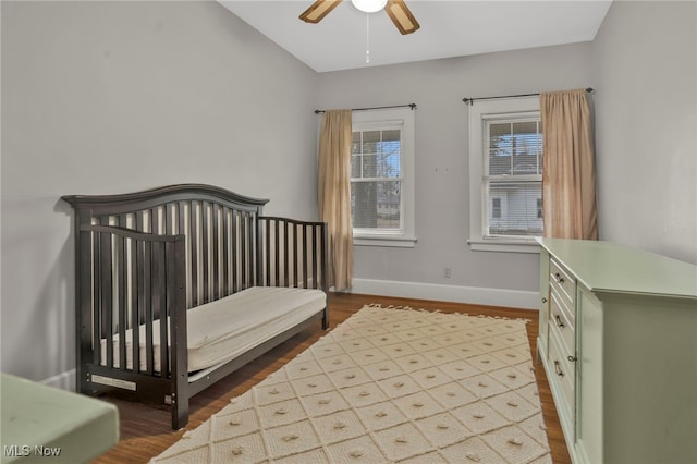 bedroom with hardwood / wood-style flooring and ceiling fan