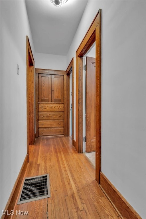 hall with light hardwood / wood-style flooring