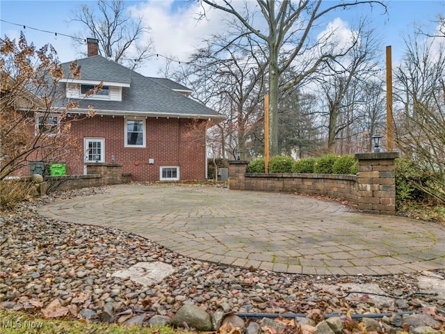 rear view of property featuring a patio