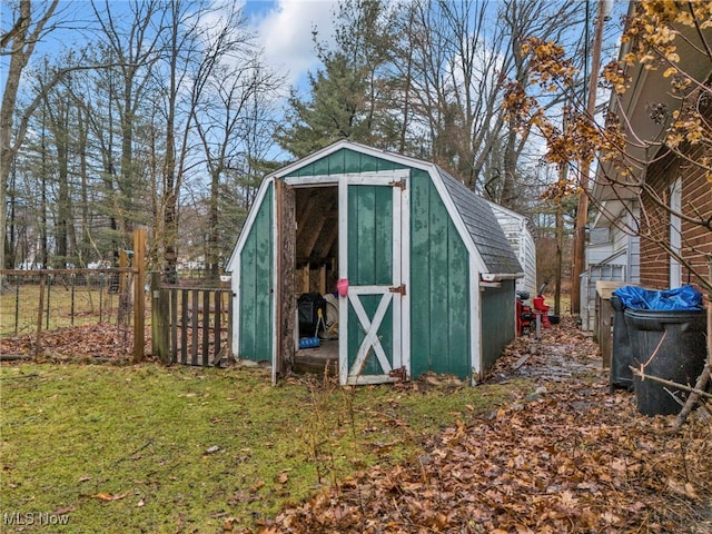 view of outbuilding with a lawn