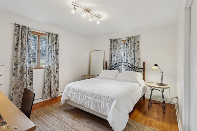 bedroom featuring wood-type flooring