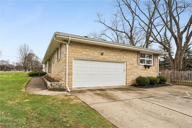 garage featuring a lawn