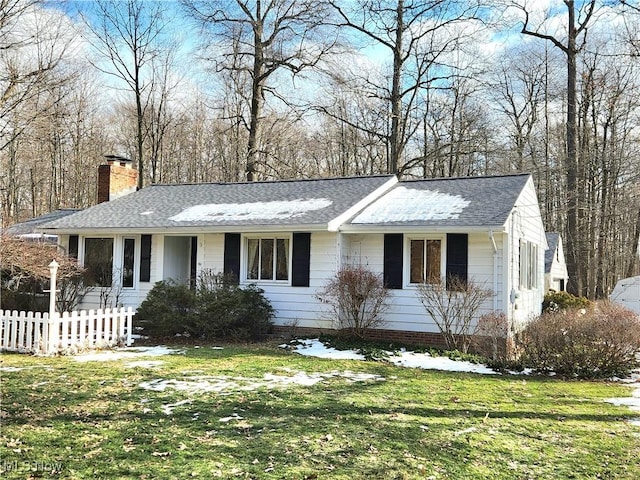 ranch-style home with a front yard