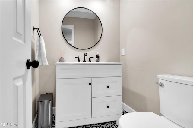 bathroom with vanity and toilet