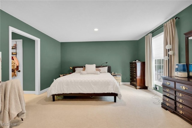 bedroom featuring light carpet