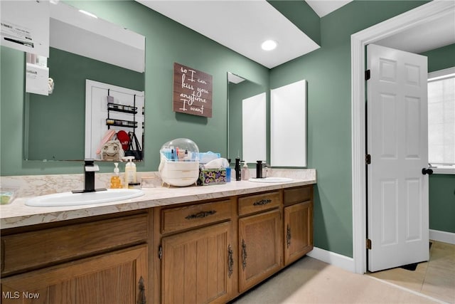 bathroom with vanity and tile patterned flooring