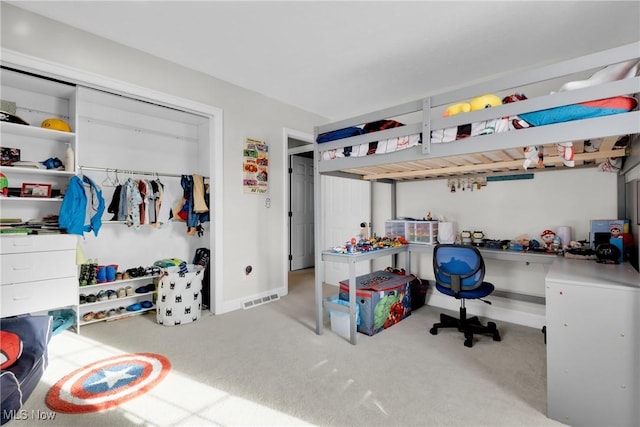 bedroom with light colored carpet