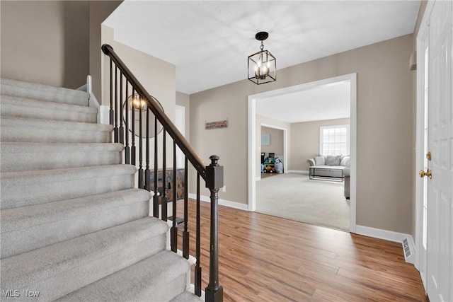 foyer featuring a notable chandelier and light wood-type flooring