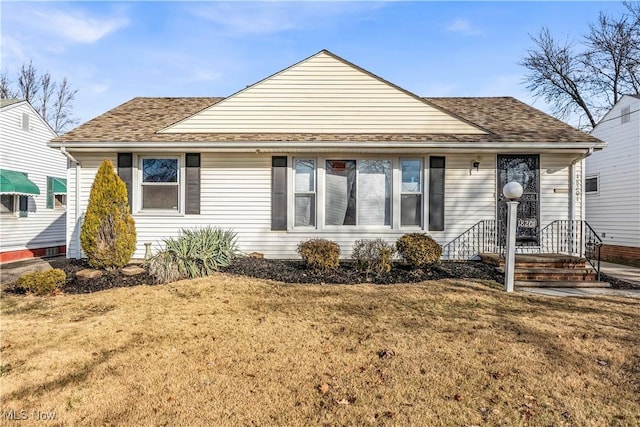 bungalow-style home featuring a front yard