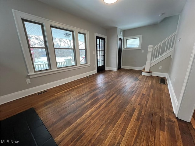 interior space with dark hardwood / wood-style floors