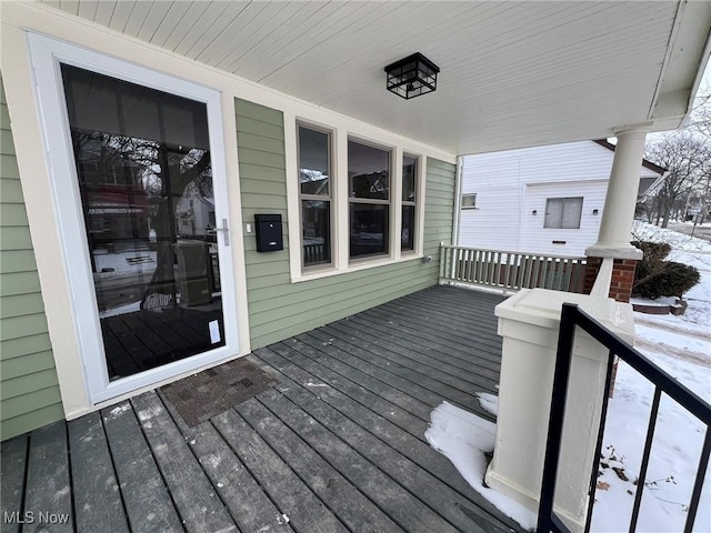 view of snow covered deck