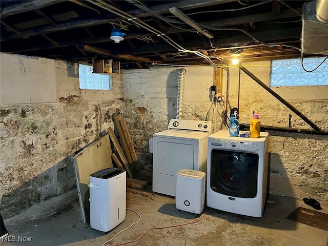 laundry room with washing machine and clothes dryer