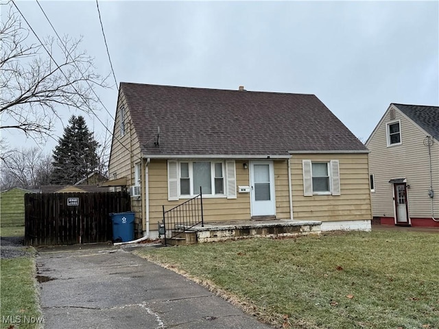 bungalow-style home with a front yard