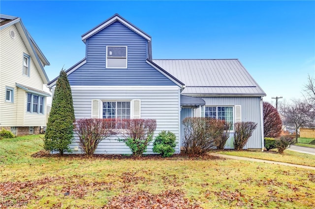 view of side of home with a lawn