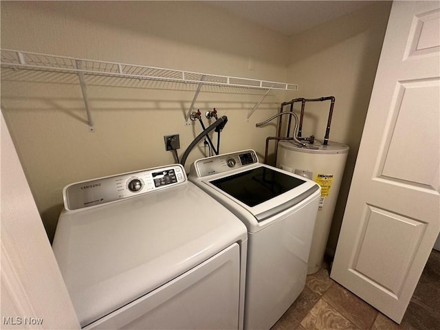 laundry area featuring washer and dryer and electric water heater