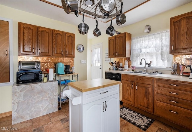 kitchen with a center island, sink, and backsplash