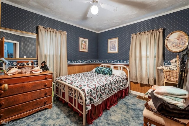 carpeted bedroom featuring ornamental molding and ceiling fan