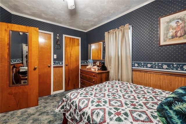 bedroom featuring ornamental molding and carpet