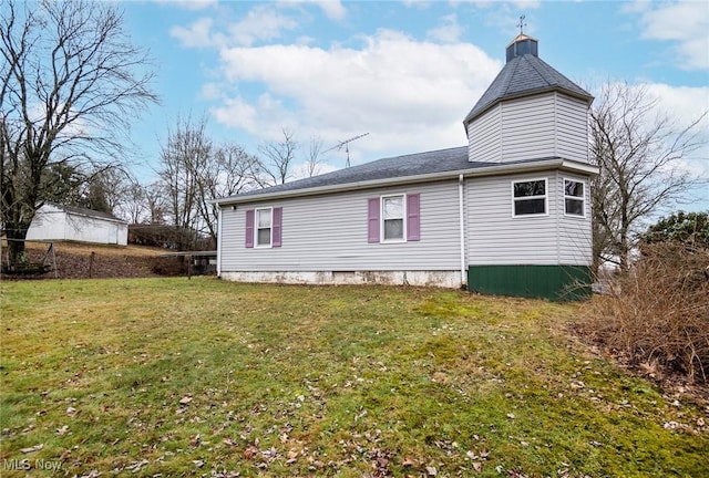 view of home's exterior featuring a lawn