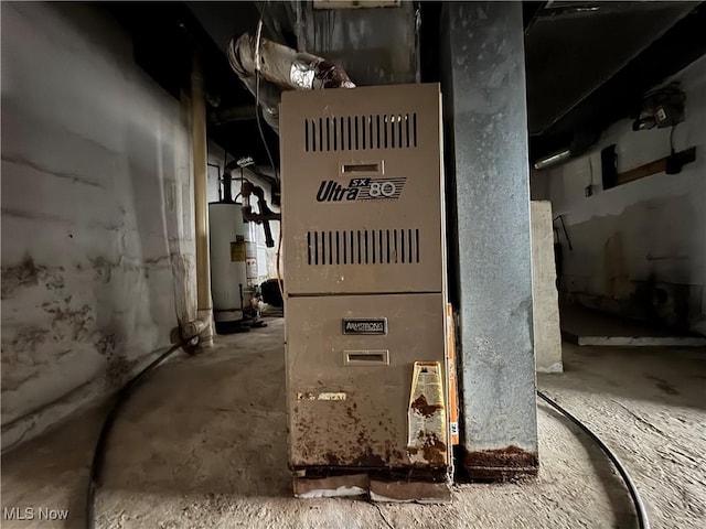 utility room featuring gas water heater