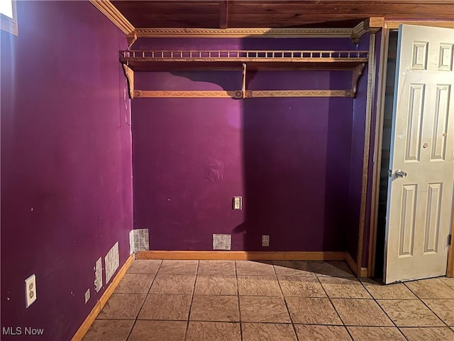 washroom featuring tile patterned flooring