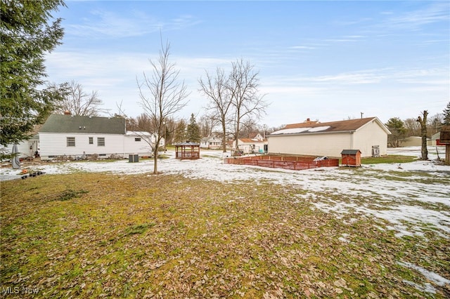 view of yard covered in snow