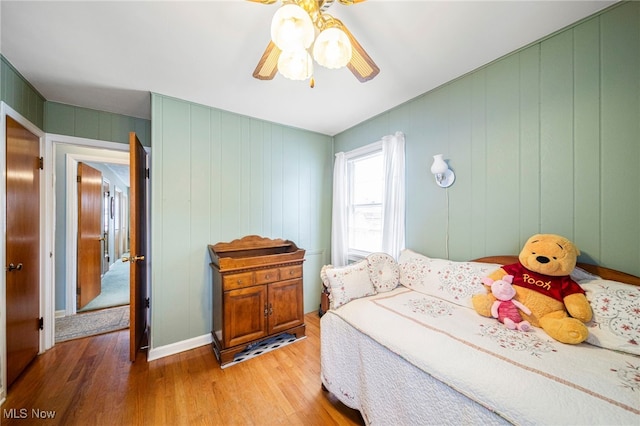 bedroom with ceiling fan and wood-type flooring