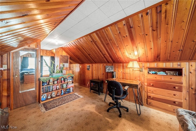 office area with wood ceiling, vaulted ceiling, light carpet, and wood walls