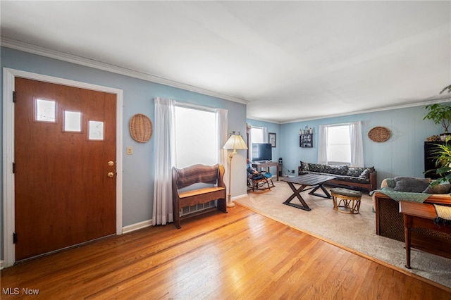 living room featuring ornamental molding and hardwood / wood-style floors