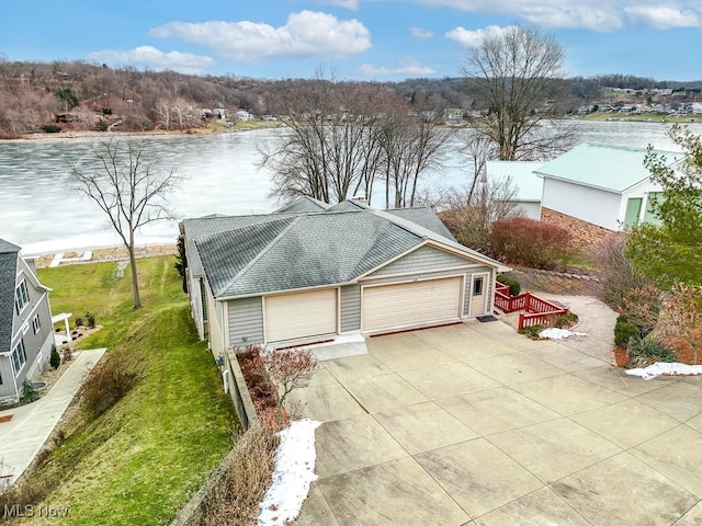 birds eye view of property with a water view