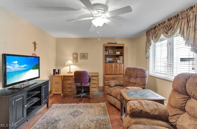 office space featuring dark hardwood / wood-style floors and ceiling fan