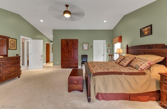 bedroom featuring high vaulted ceiling, light carpet, and ceiling fan