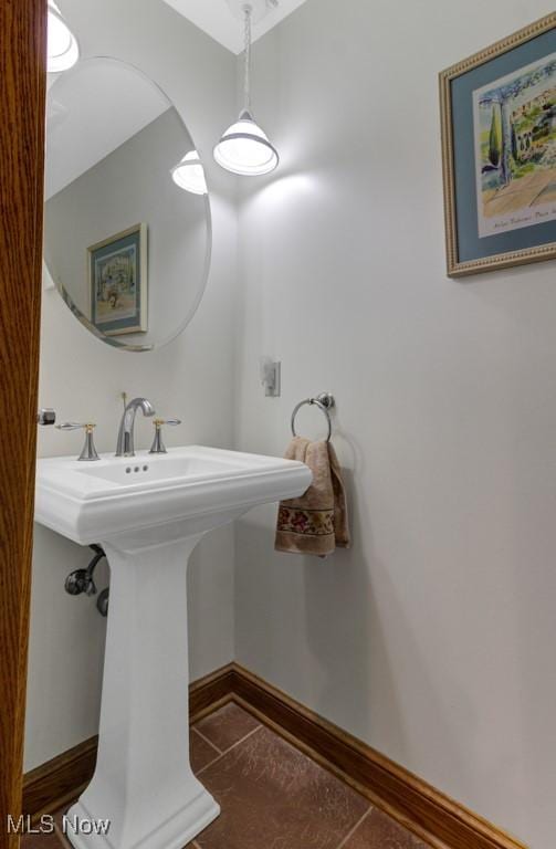 bathroom featuring tile patterned flooring and sink