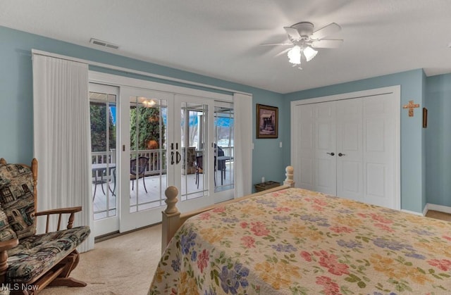 carpeted bedroom with a closet, access to exterior, ceiling fan, and french doors