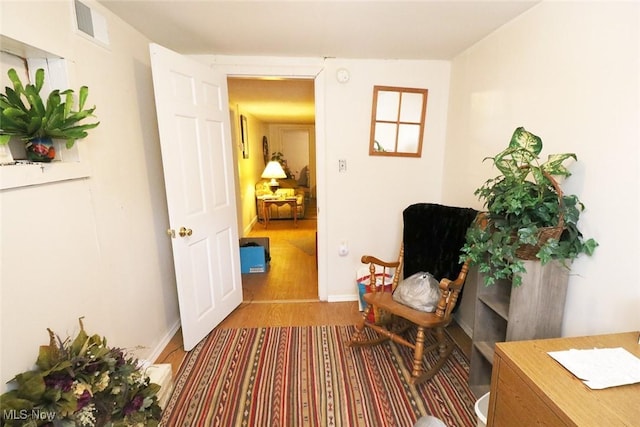 sitting room featuring hardwood / wood-style flooring