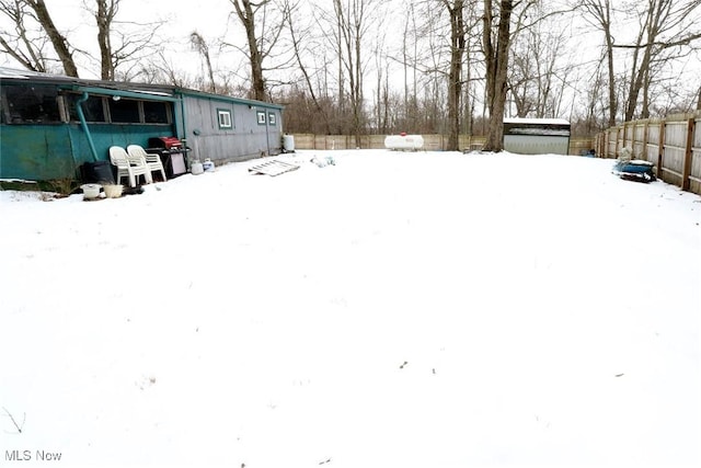 view of yard covered in snow