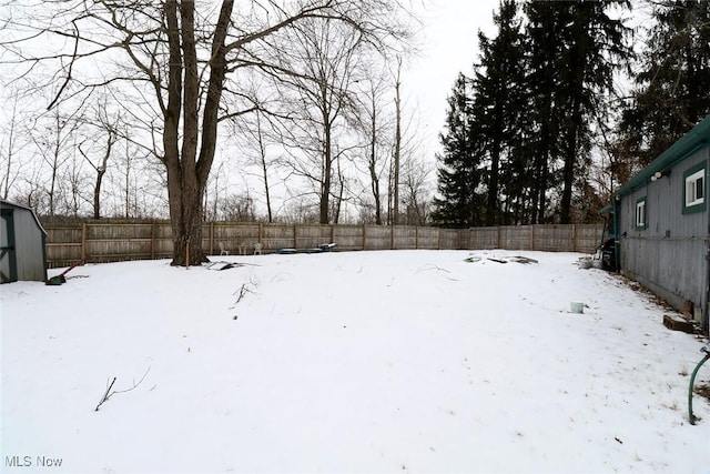 view of yard covered in snow