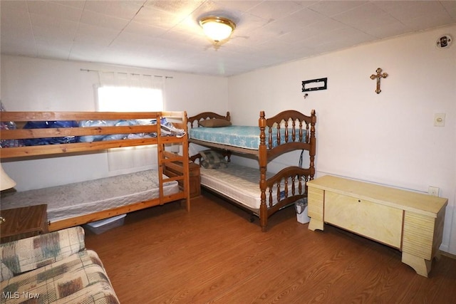 bedroom featuring dark wood-type flooring