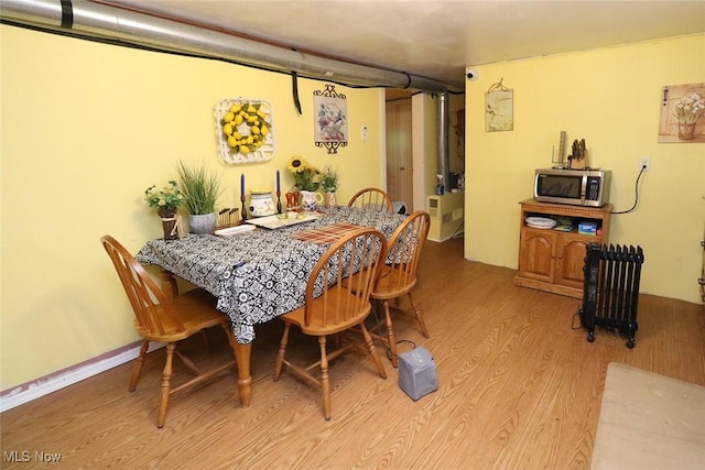 dining area featuring light wood-type flooring