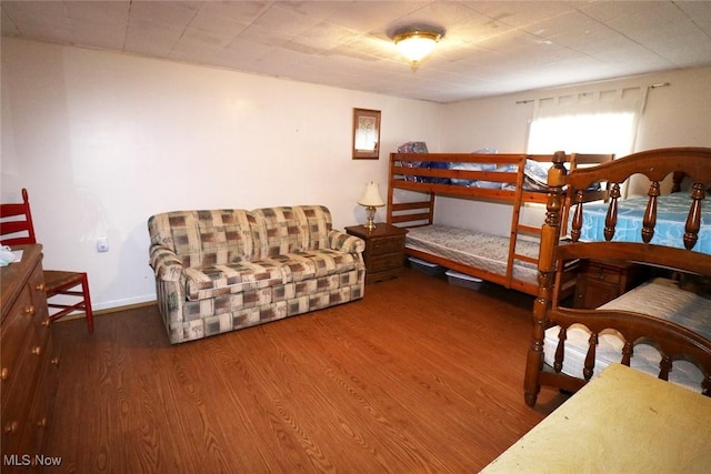 bedroom featuring wood-type flooring