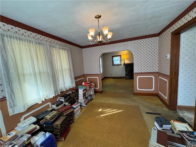 carpeted dining room featuring an inviting chandelier