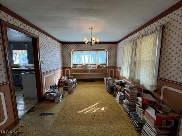 miscellaneous room with an inviting chandelier, carpet flooring, and sink