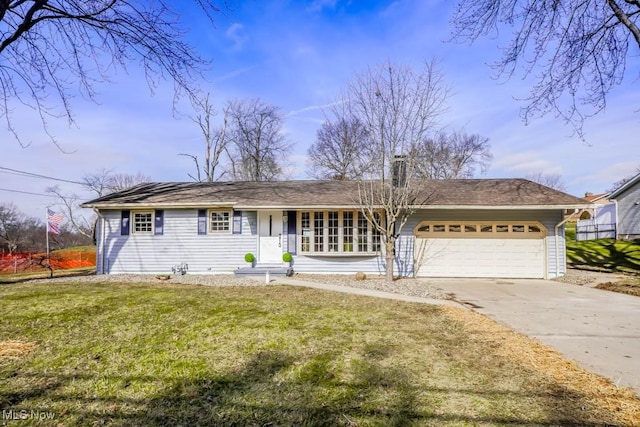 single story home featuring a garage and a front lawn